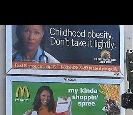 Adjacent billboards with contradictory messages about diet