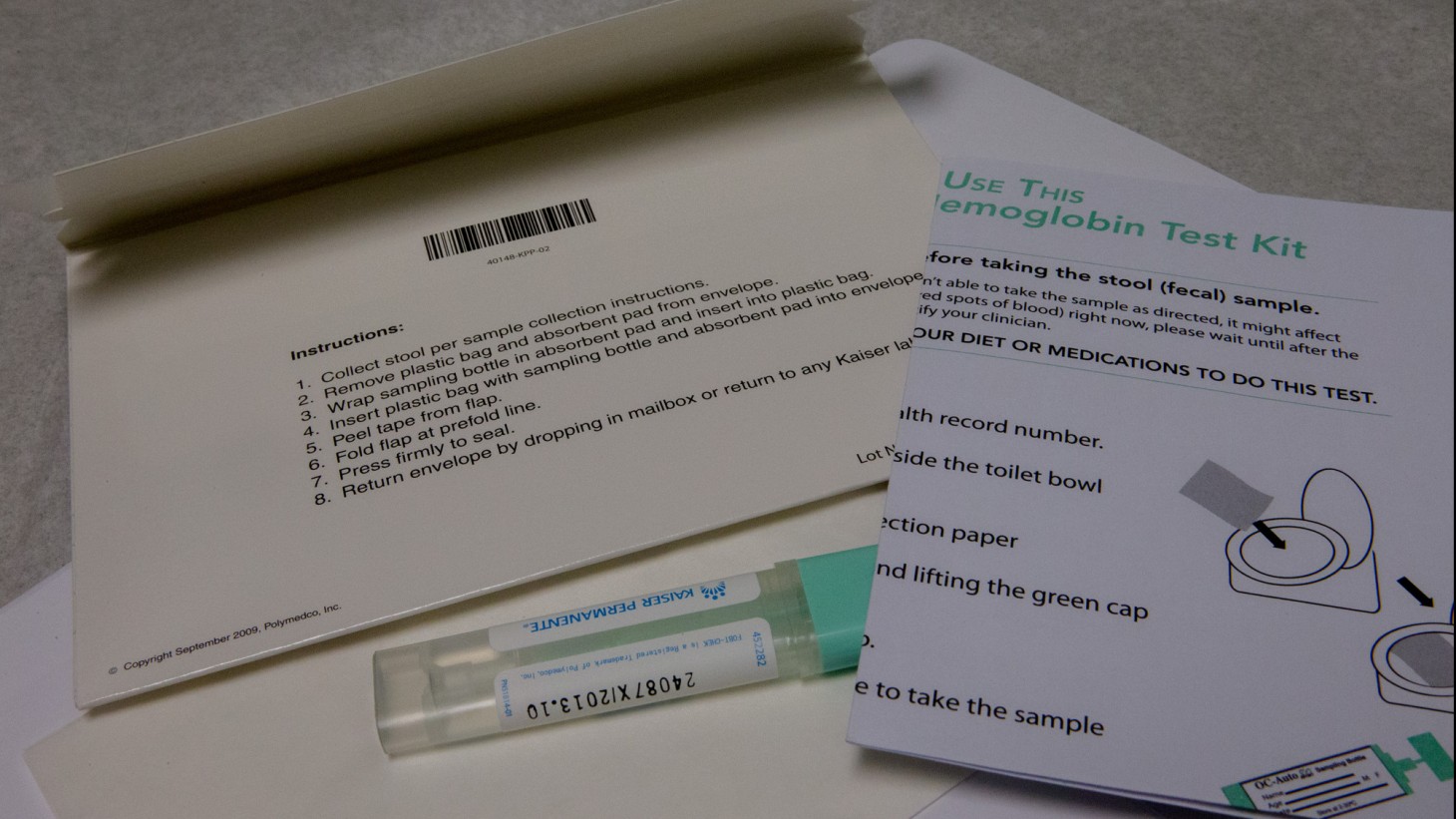 Envelope, test tube and instructions for a FIT kit 