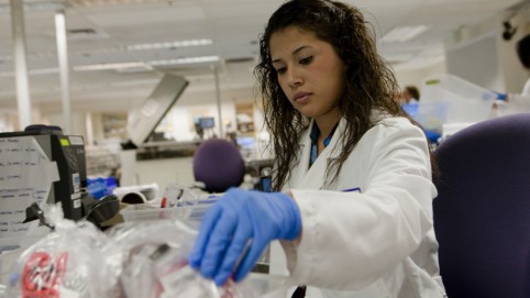 Female tech handling specimen bags.
