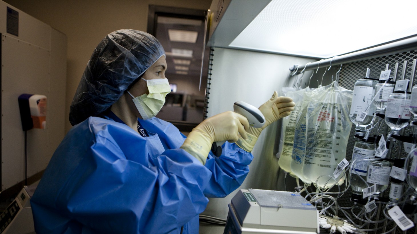 Nurse checks IV medications.